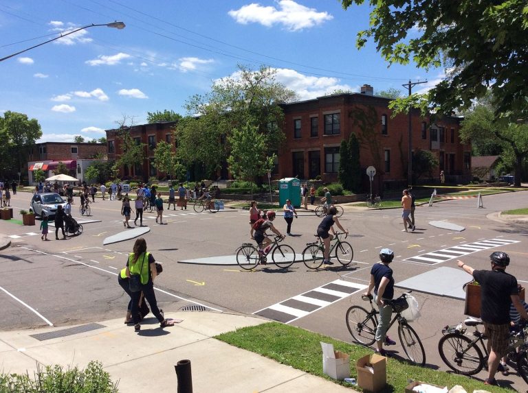 cyclists riding in a protected bike lane